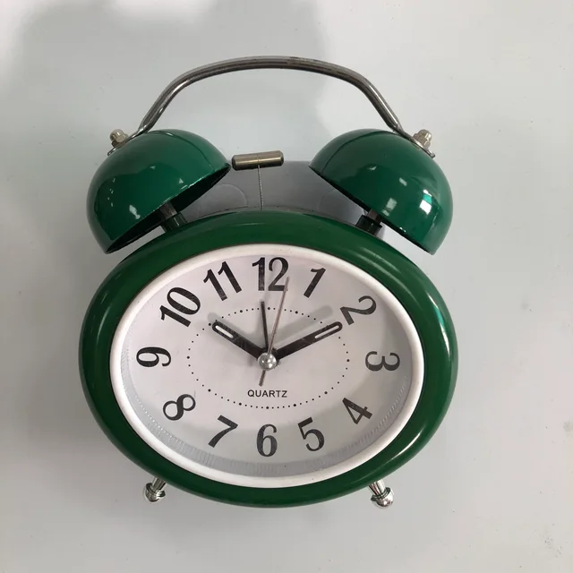 Oval-shaped twin bell alarm clock