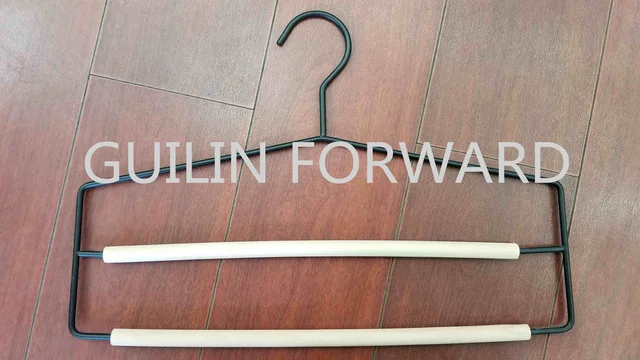 Metal hanger with wood bar