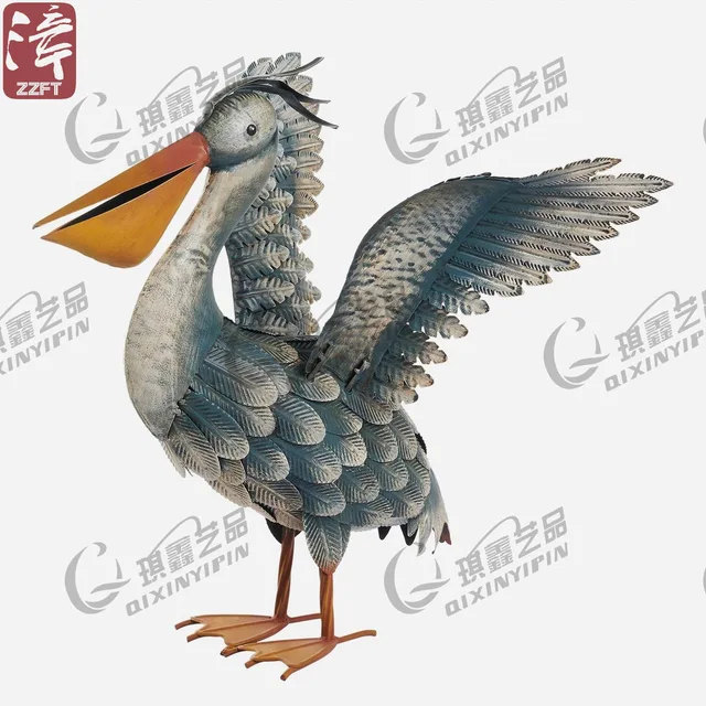 Metal pelican spreading wings