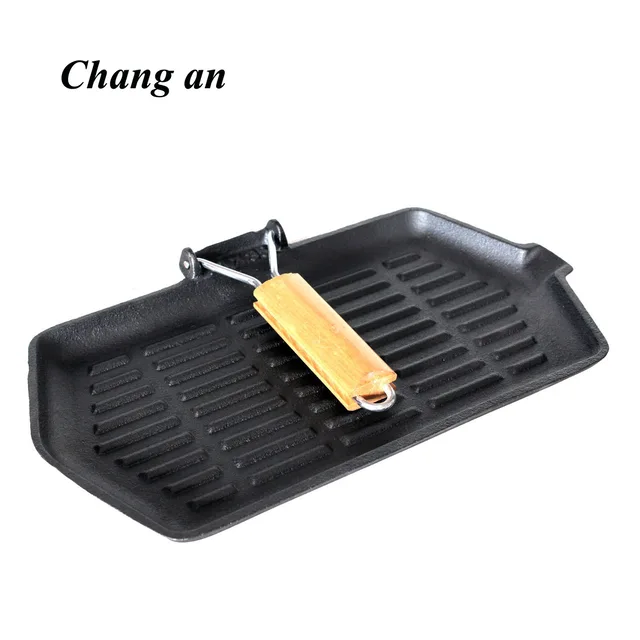 Cast iron griddle with wooden steel handle