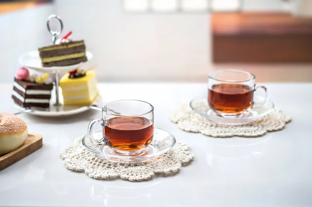 Glass cup and saucer