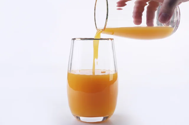 Glass cup with golden rim