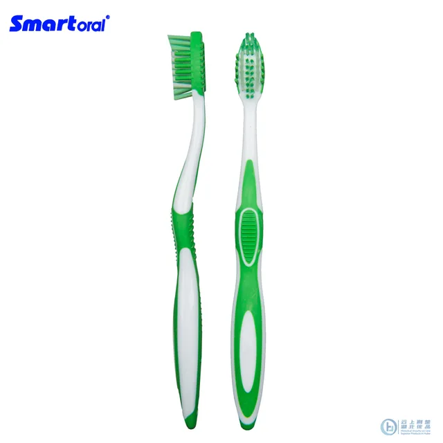 Adult toothbrush with tongue cleaner and massage