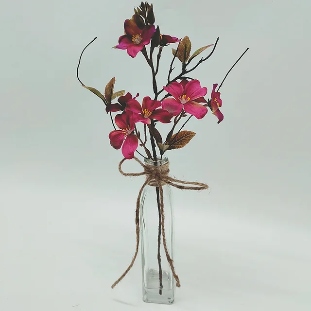 Artificial flower arrangement with glass base for decoration