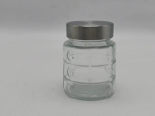 Round glass jar with metal screw type lid