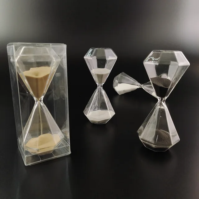 Glass hourglass black sand