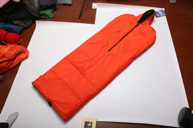 Hand-out sleeping bag with hat