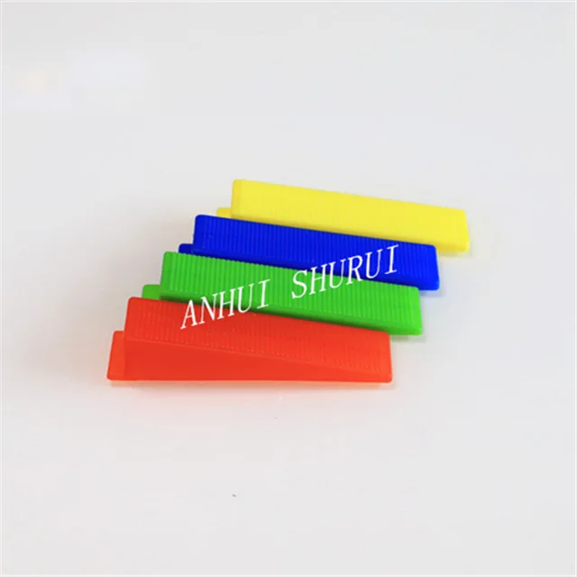 Tile leveling system wedge and pliers